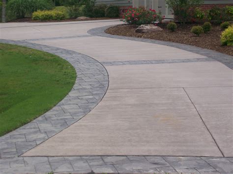 Concrete Stamped Border Driveway With Broom Finish Interior.