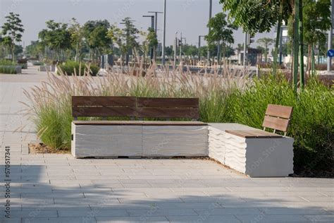 Stylish concrete benches in an empty park, a view of a modern square with landscape design Stock ...