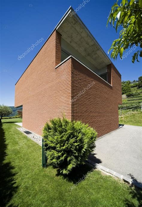 Modern brick house Stock Photo by ©Zveiger 34725841