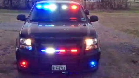 Feniex lights in 2013 Black Chevy Police Tahoe front view with flashing take-downs - YouTube