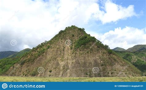 Triangle shaped mountain stock image. Image of background - 129558423