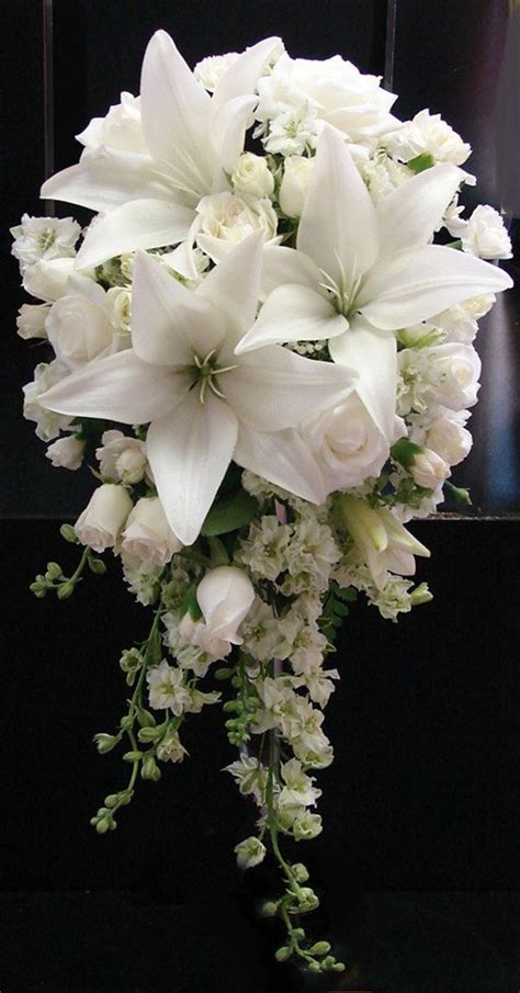 White Lily and Rose Wedding Bouquet | White wedding bouquets, Rose wedding bouquet, Flower ...