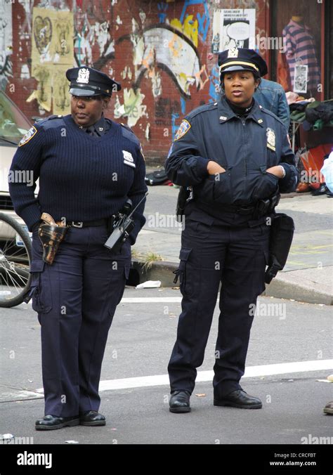 Two police officers with blue uniforms, USA, Brooklyn, New York City Stock Photo - Alamy