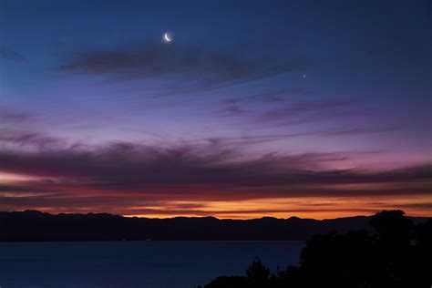 Nelson moonset at sunset : r/newzealand