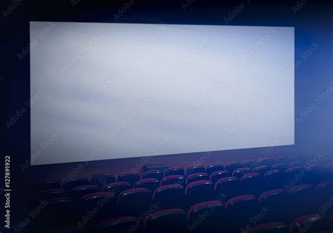 Empty movie theater with projection on blank screen Stock Photo | Adobe ...