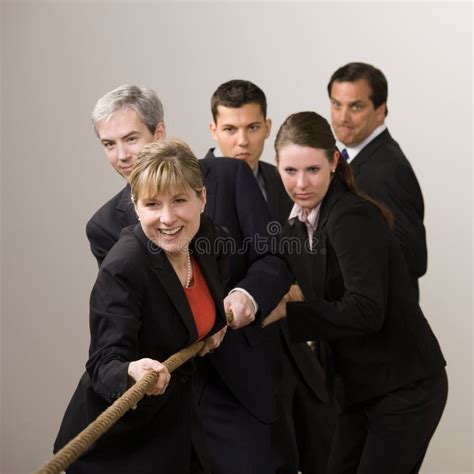 Group of Co-workers Pulling Rope in Tug-of-war Stock Photo - Image of pull, caucasian: 6580804