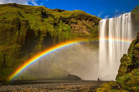 Skogafoss Waterfall and Rainbow - Iceland Photograph by Stuart Litoff - Pixels