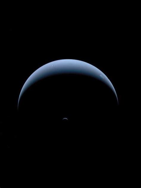 Neptune and Triton, captured by Voyager 2 on its way out of the solar system in August 1989. : r ...