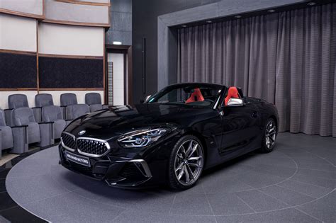 BMW Z4 M40i featured in Sapphire Black Metallic with Magma Red interior