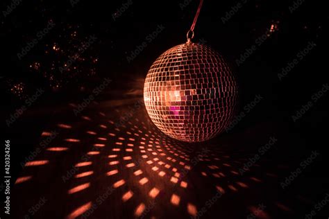 Colorful disco mirror ball lights night club background. Party lights disco ball. Selective ...