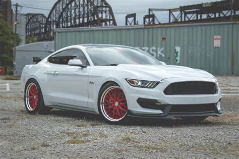 Striking Contrast: Custom Red Vossen Wheels on White Ford Mustang — CARiD.com Gallery