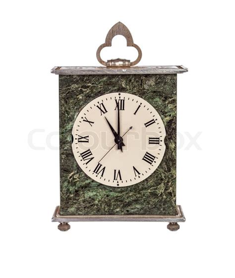 Eleven o'clock on isolated mantel clock ... | Stock Photo | Colourbox