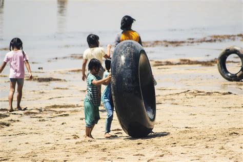 Sorong, Indonesia 2021- People on the beach 3363890 Stock Photo at Vecteezy