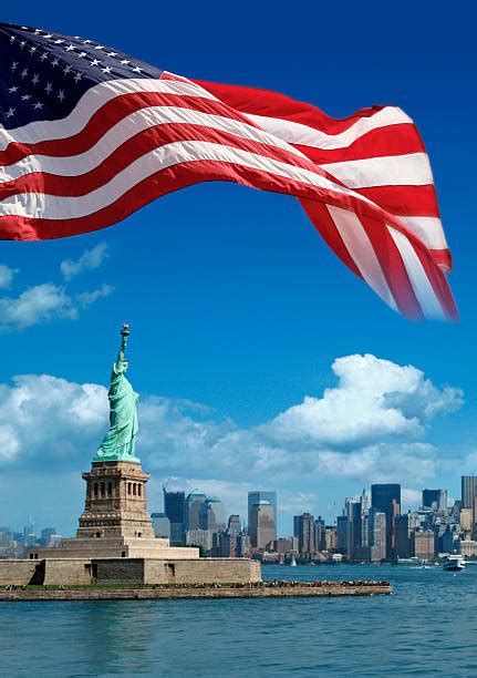 Royalty Free The Statue Of Liberty And The American Flag Pictures, Images and Stock Photos - iStock