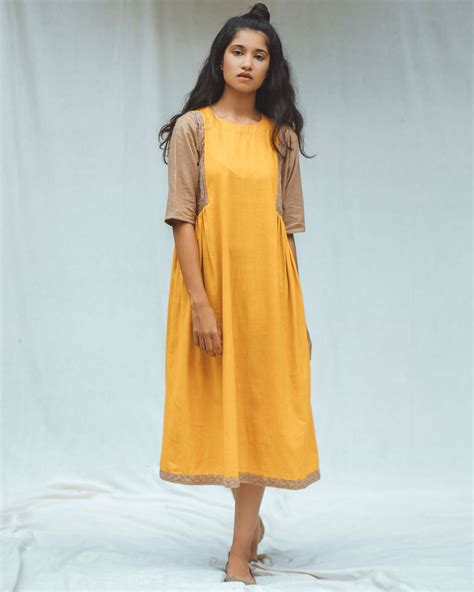 Marigold dress by The Sweven Studio | The Secret Label