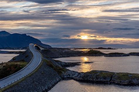 Premium Photo | Fantastic shot of an atlantic road in norway in the sunset.