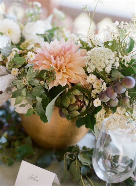 Late summer centerpiece featuring Cafe Au Lait dahlias, plumbs, artichokes, and herbs… | Wedding ...