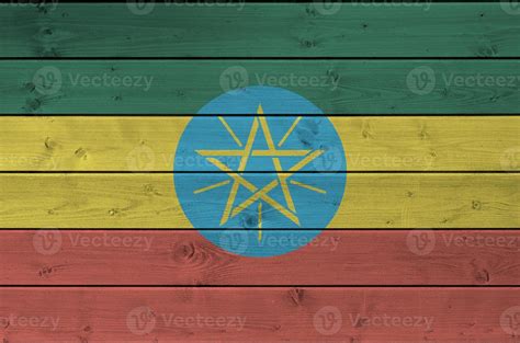 Ethiopia flag depicted in bright paint colors on old wooden wall ...