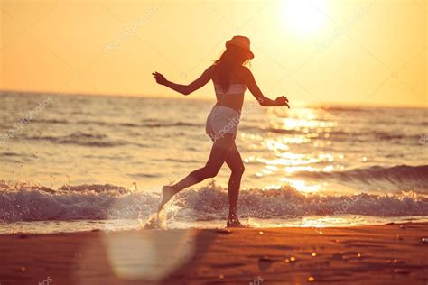 Running barefoot on the beach — Stock Photo © mike_laptev #113416140