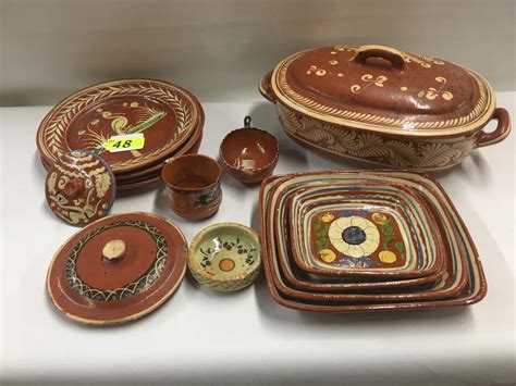 Sold Price: 12 PIECES MEXICAN CLAY POTTERY, 4 DINNER PLATES, 2 LIDS, ONE COVERED CASSEROLE, 3 ...