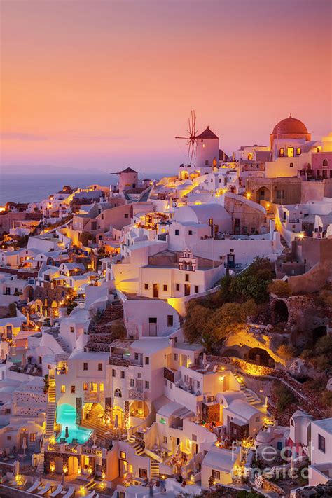 Windmill and white houses at sunset, Oia, Santorini, Greece Photograph by Neale And Judith Clark ...