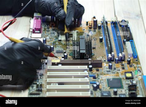 replacement of the chipset cooling system from the computer motherboard on the table Stock Photo ...