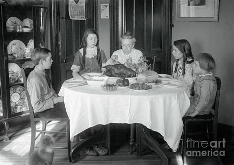 Family Sitting Around Dinner Table Photograph by Bettmann - Pixels