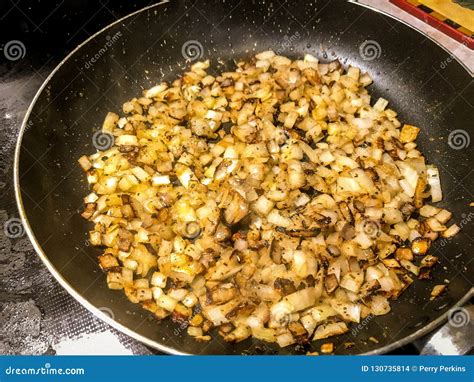 Sauteing Garlic and Onions stock photo. Image of sauteing - 130735814