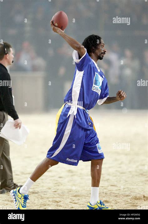 Snoop Dogg throws a football at Directv's Sixth Annual Celebrity Beach Bowl in Indianapolis ...