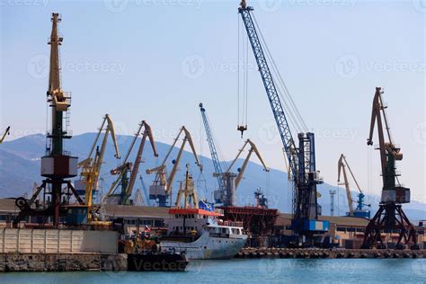 cranes and ships in a port. 16552981 Stock Photo at Vecteezy