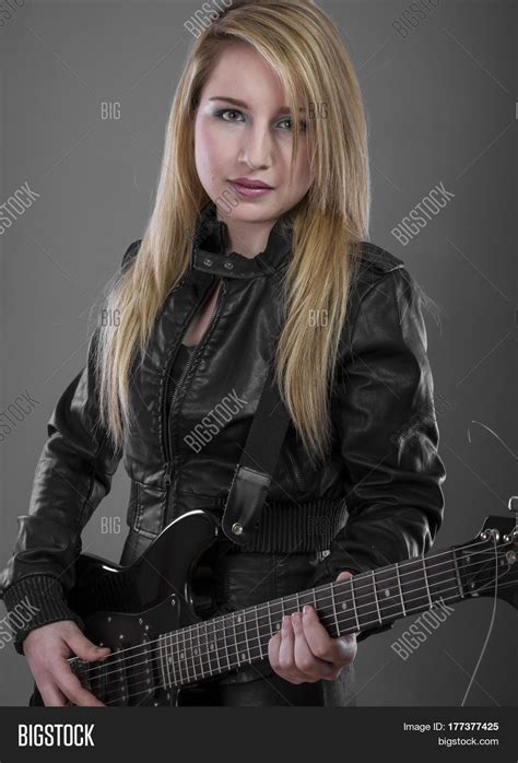 Sexy Rockstar, rocker woman with black leather outfit, lovely blonde ...