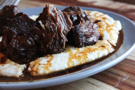 Porter braised beef cheek with grits & sorghum syrup