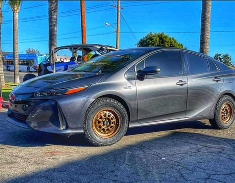 Prius PRIME lifted with the 2" inch lift kit looks ready for battle ...