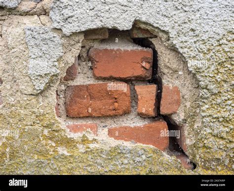 Old and cracked brick wall background closeup Stock Photo - Alamy