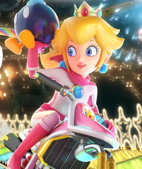 A close up of Peach on Mario Kart 8 Deluxe's box art | Mario Kart in 2021 | Peach mario ...