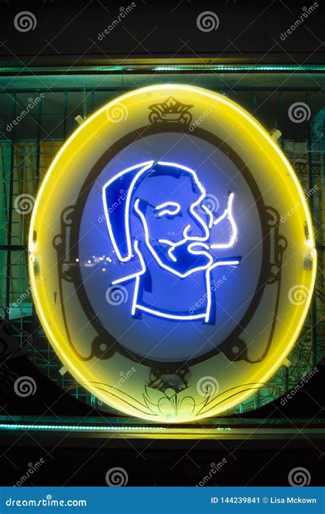 Zig Zag Man Logo On A Neon Sign Editorial Photo | CartoonDealer.com #144239879