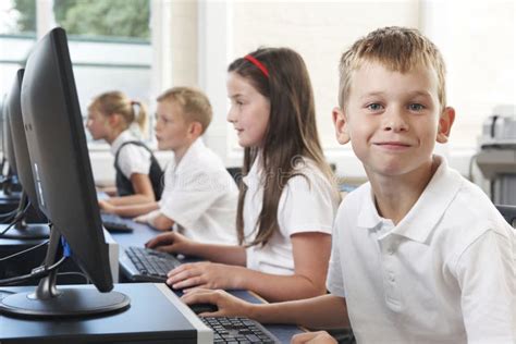 Male Elementary Pupil in Computer Class Stock Photo - Image of girl ...