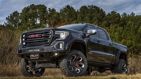 GMC BLACK WIDOW LIFTED TRUCKS — SCA Performance | Black Widow Lifted Trucks