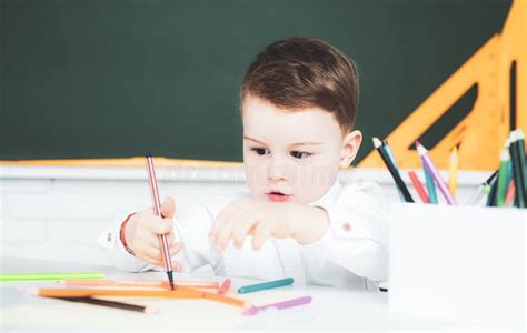 Kid Boy Writing in Classroom. Schoolboy Studying Homework during Her Lesson at Home. Stock Photo ...