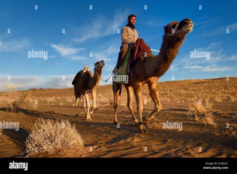 Iran, Isfahan province, Dasht-e Kavir desert, Mesr in Khur and Biabanak County, man riding his ...