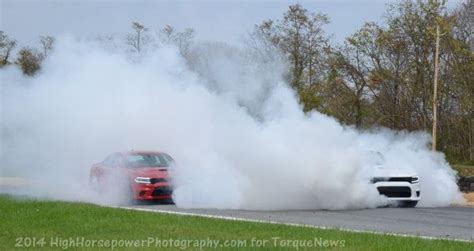 Monstrous Dodge Charger Hellcat Burnout with Three Cars at One Time | Torque News