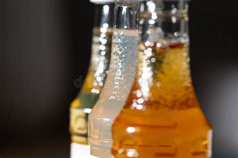 Liquor Alcohol Bottles Full of Different Color Liquids Stock Photo - Image of texture, bottle ...