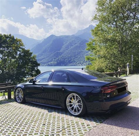 Black Audi S8 parked by the scenic road