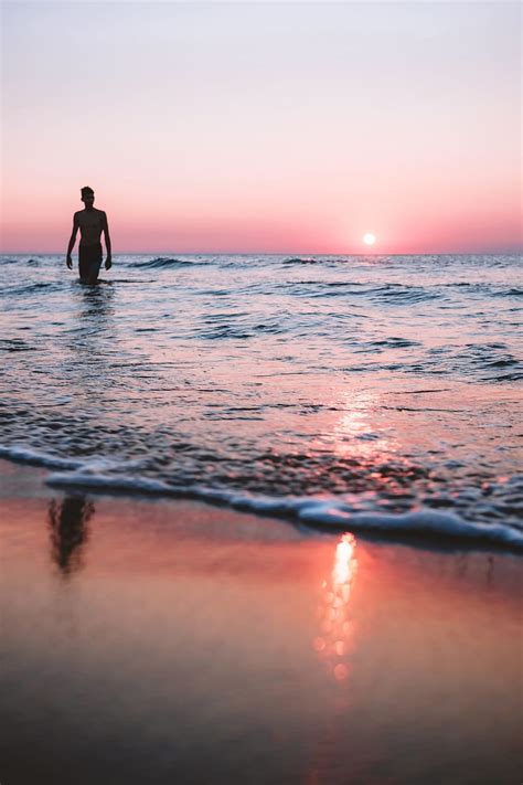 HD wallpaper: Loner, beach, ocean, sunset, beach sunset, moody, sea, portrait | Wallpaper Flare