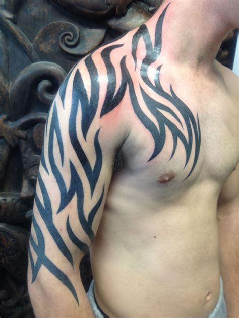 Best Tribal Arm Tattoo Designs for Men - The Xerxes