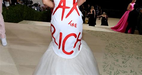 AOC Wears "Tax The Rich" Dress to Met Gala - The Outlook