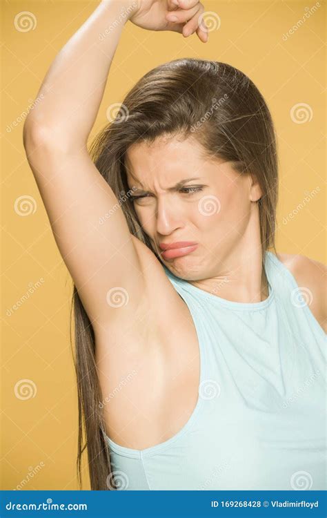 Young Woman Smells Her Armpit Stock Photo - Image of sweating, odor: 169268428