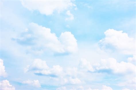 Premium Photo | Bright pastel blue sky with white clouds - background ...