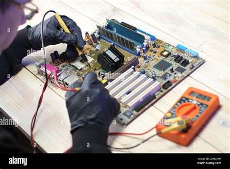 replacement of the chipset cooling system from the computer motherboard on the table Stock Photo ...