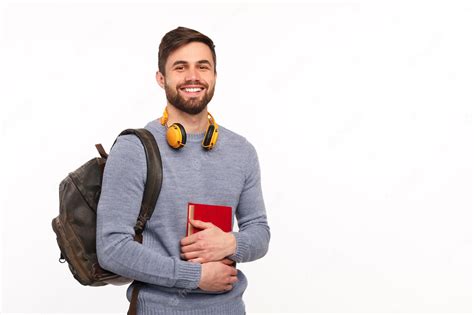 Premium Photo | Cheerful male student with backpack